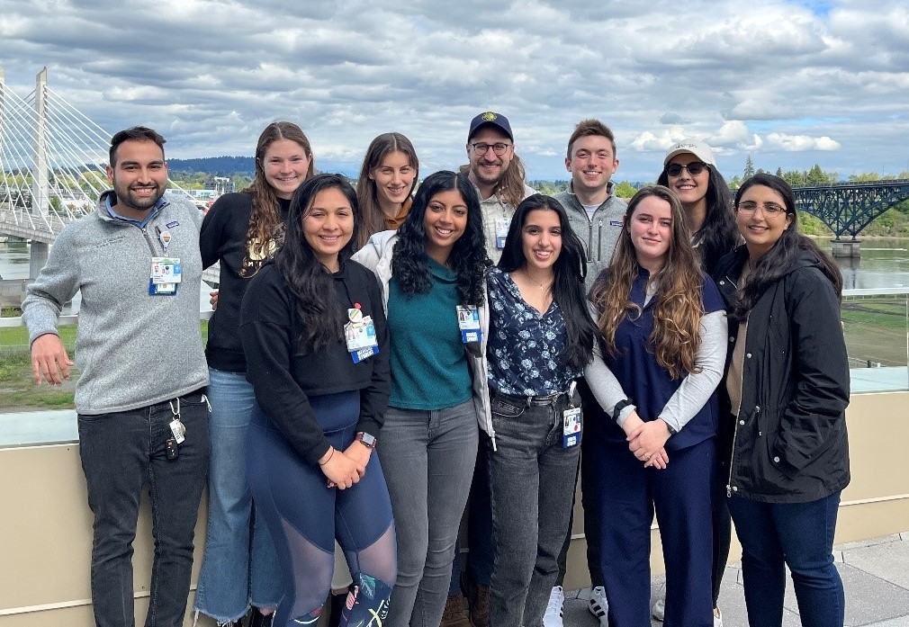 Group of students standing outside smiling for the camera