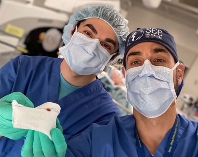 Ophthalmology resident Dr. Marcus Altman does cataract surgery with Dr. John Clements.