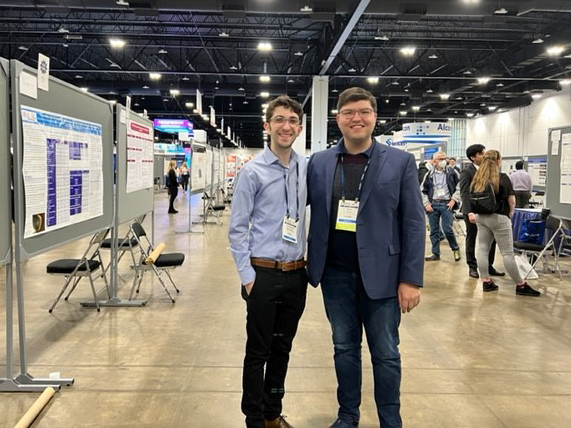 Ophthalmology residents Drs. Ogul Uner and Chris Rosenberg present a poster at ARVO