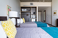 Our standard private bedrooms have two beds, desk, TV, mini fridge, toaster oven and coffee pot.