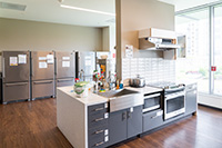 The community kitchen has everything you need to cook for your family, including refrigerators, ovens, microwaves, sinks, a toaster, a coffee maker, and basic cooking supplies and spices.