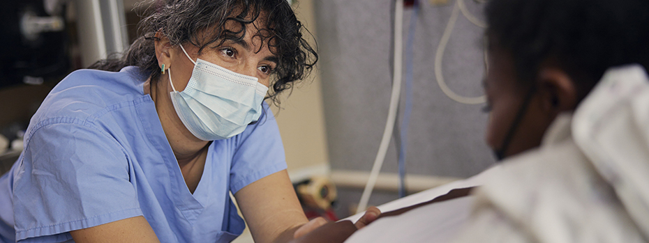 Nurse-midwife Olivia Kroening-Roché comforts her patient during labor.