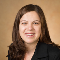 Smiling woman in brown suit jacket