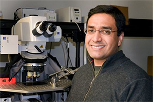 Vivek Unni, seen smiling in his lab