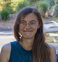 Anna M. Bowman, outdoors and smiling