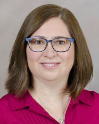 Professional portrait of Chris Larsen, MS, Associate Director of Finance and Operations for the Oregon Clinical and Translational Research Institute.