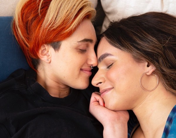 Two people close to each other.