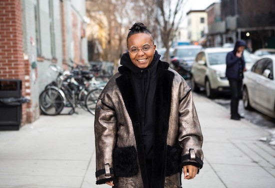 A person standing outside in a winter coat.