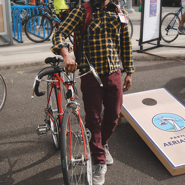 Person holds a bike at the Tram terminal