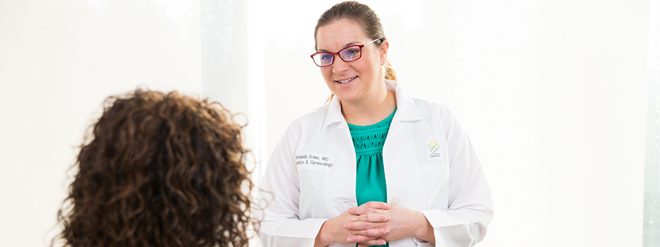 Dr. Ecker meets with a patient.
