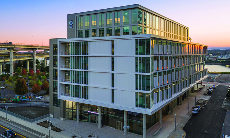 A photo of 博彩网站's Knight Cancer Research Building at sunset.