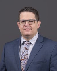 Professional portrait of Jonathan Jubera, OCTRI Bomedical Innovation Program Senior Project Manager.