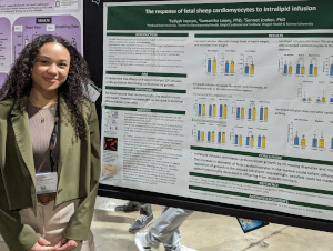 Kaliyah presents her poster at the APS poster session.