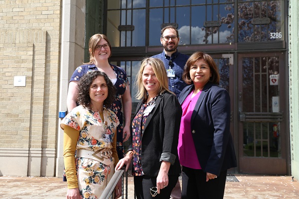 School of Medicine faculty development team in front of the 博彩网站 Auditorium