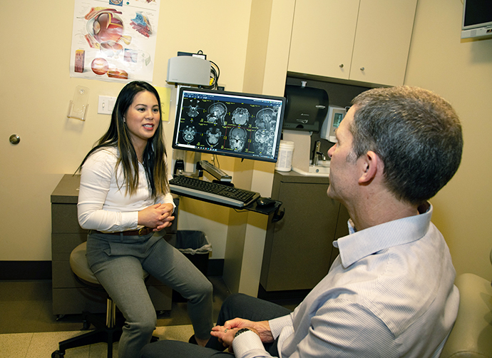 Dr. Amanda Redfern sees a patient in neuro-ophthalmology clinic.
