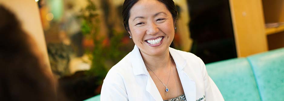 A smiling healthcare provider.