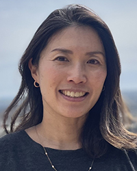 Hiroko Kiyoshi-Teo smiles at the camera.