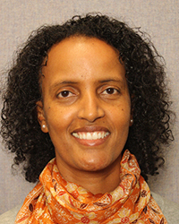 Ruth Tadesse smiles at the camera.