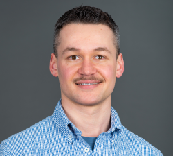 Professional portrait of Dan Bendelic, OCTRI Informatics Program Manager.