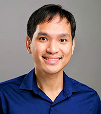 Worapol Ngamcherdtrakul wears a buttoned shirt.