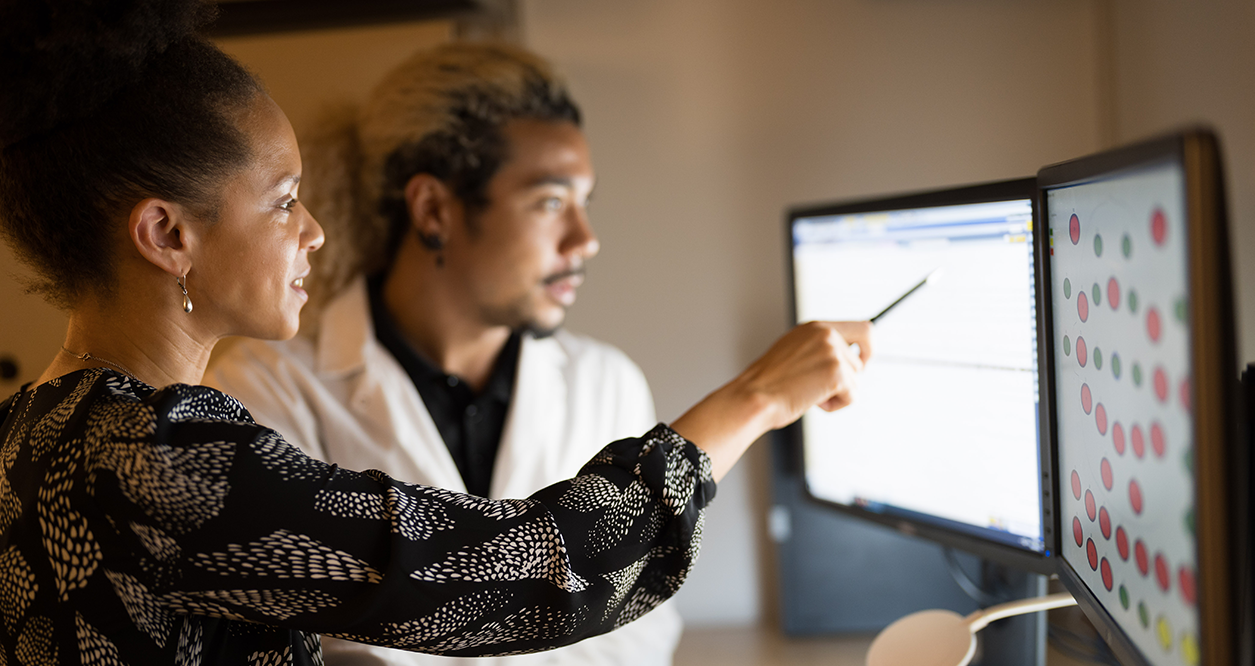 OccHealthSci researchers Nicole Bowles and Latroy Robinson review data in the sleep lab.