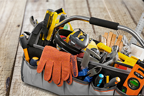 Set of tools and instruments in box isolated on background