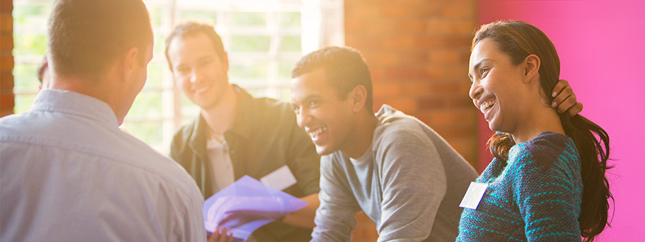 Students talking and laughing together.