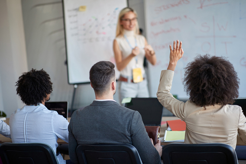 Young woman leading a workshop.