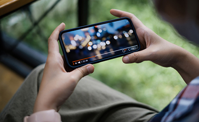 While quarantine a women watching live streaming by application on smartphone