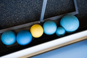 Physical therapists work with patients in well-equipped facilities.