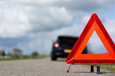 A car with a breakdown alongside the road