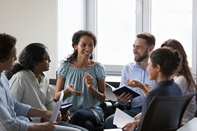 Multiethnic employees brainstorming on team training.