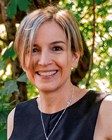 A smiling headshot of Debora Burger, of Denfeld Lab