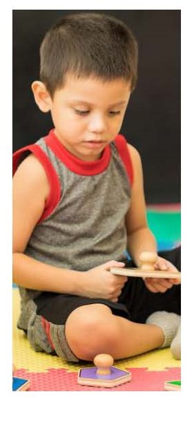 Boy plays with toy