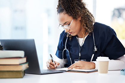 Medical student, thinking or writing books in research education, wellness studying or hospital learning.