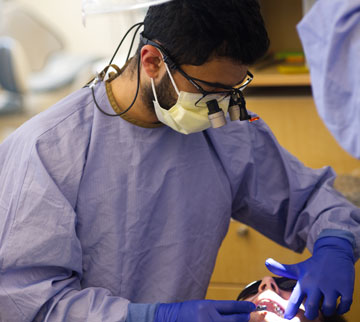 A fourth-year student examines a patient.