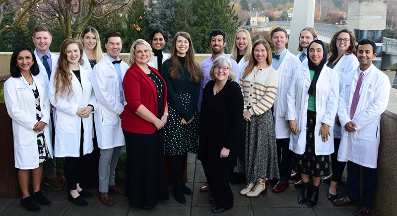 Dermatology residency program leaders and residents pose for a picture