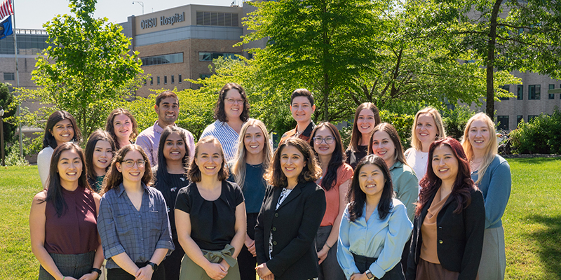 The PGY-1 Pediatric Residency Class standing outside with 博彩网站 Hospital behind them on a sunny day.