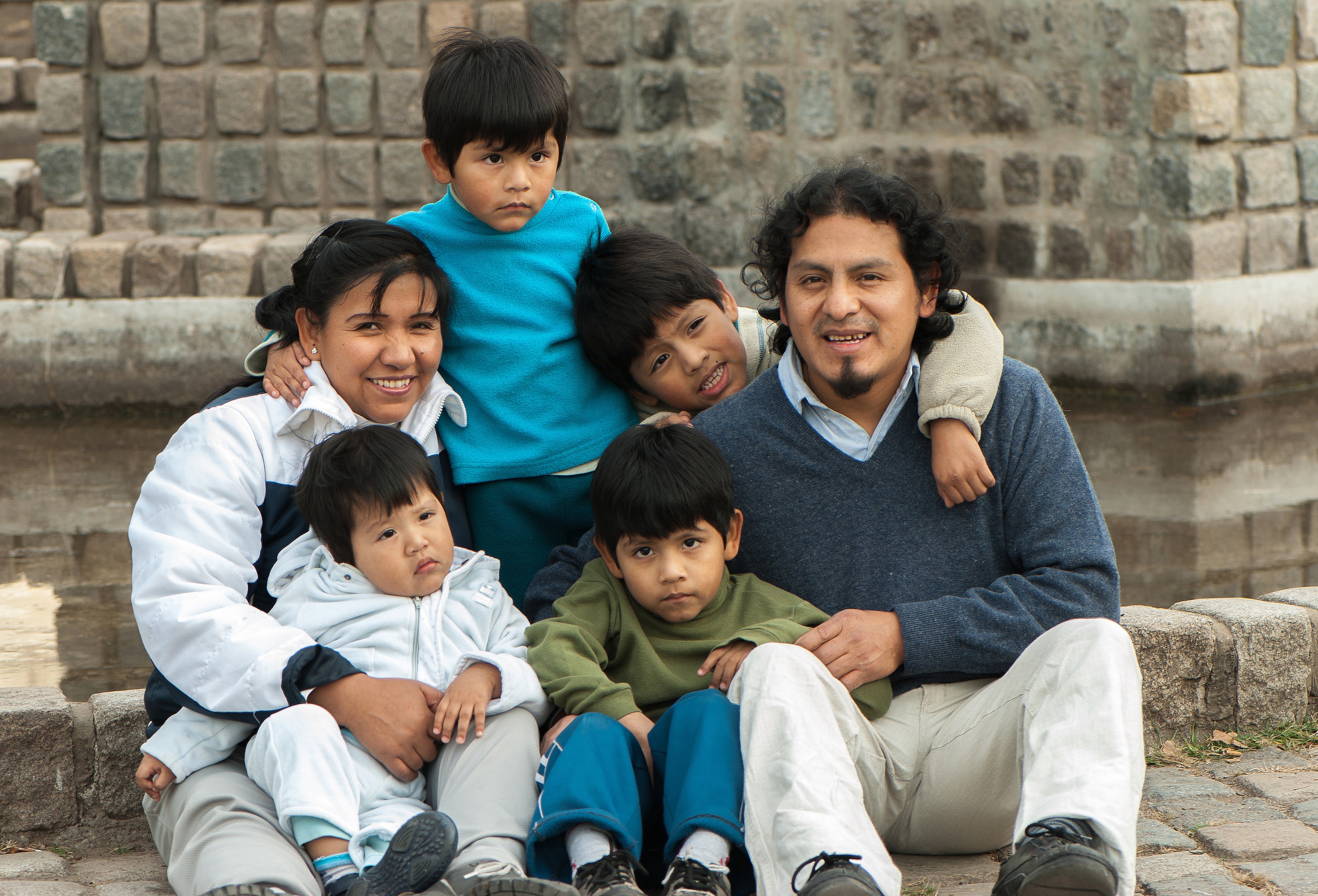 Mother father and four siblings on steps