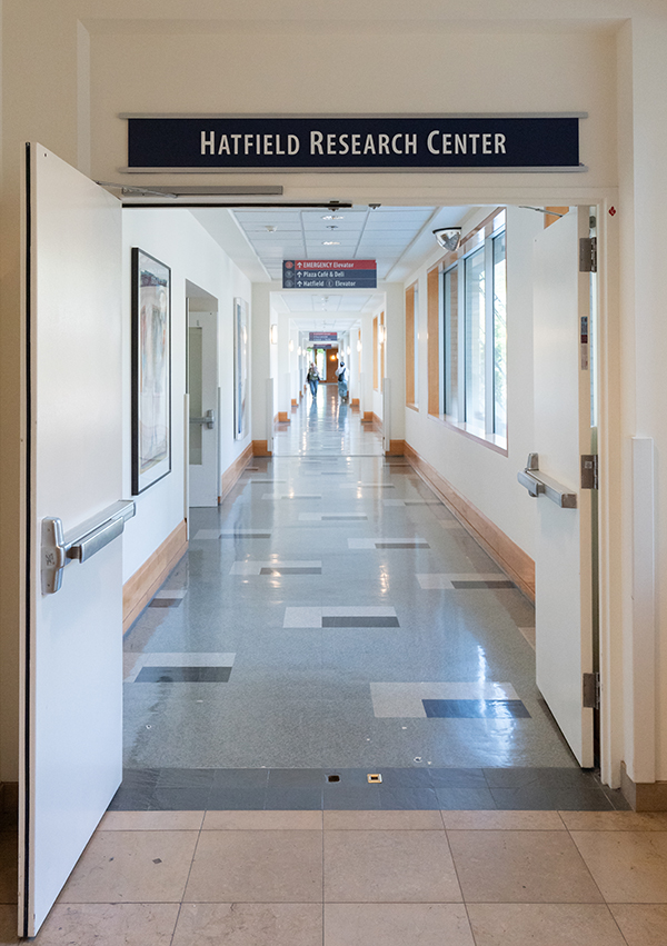 A sign for the Hatfield Research Center over an entrance to a long hallway. A sign for the Hatfield Research Center over an entrance to a long hallway.