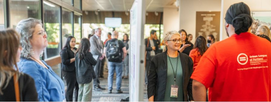 2024 CPP Grantee Conference participants chat during a poster session