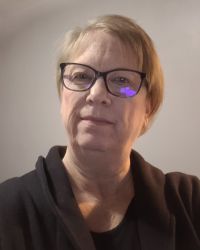 Professional portrait of Andrea Ilg, OCTRI Education Program Manager.