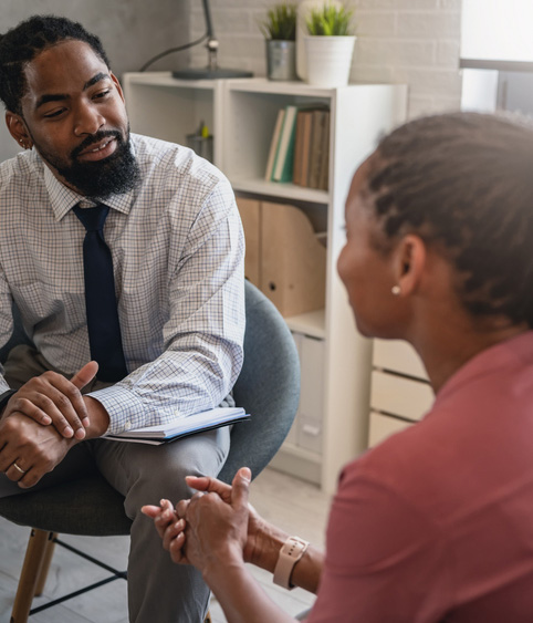 African-American women and men have a meeting.
